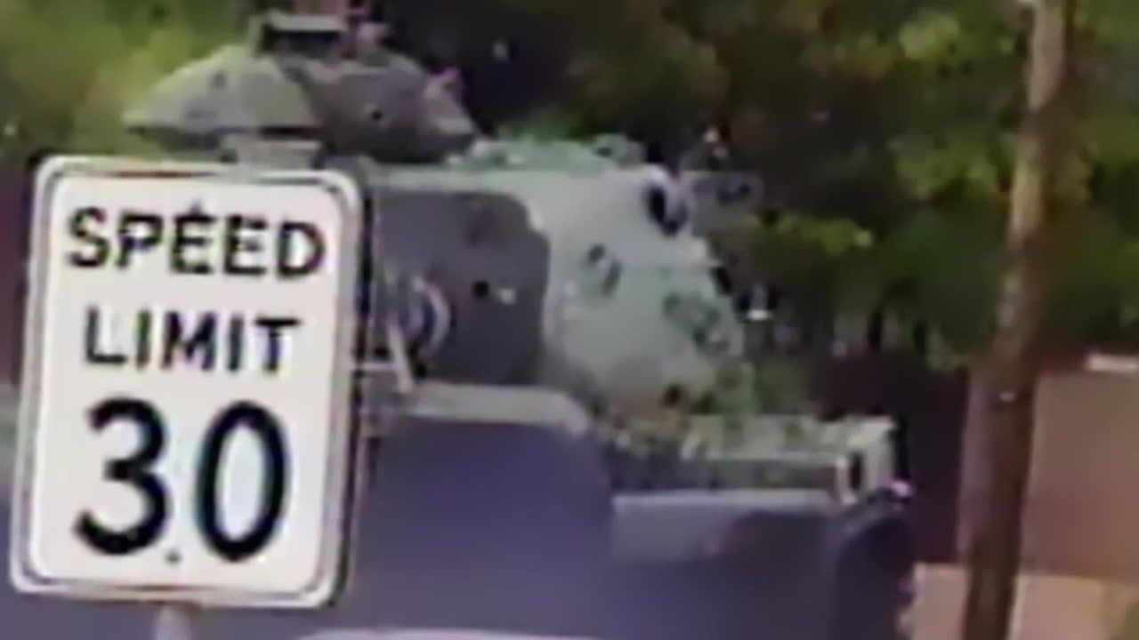 A stolen tank behind a Speed Limit 30 sign, San Diego, 1995